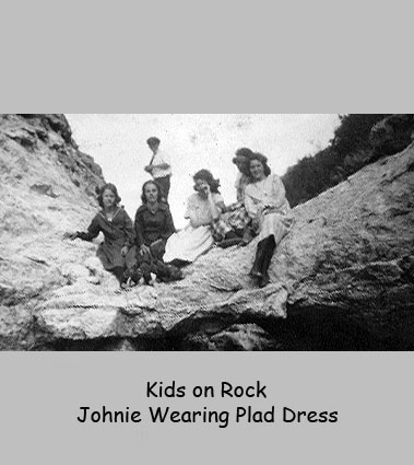 <kids on rock johnie wearing pllad dress>
