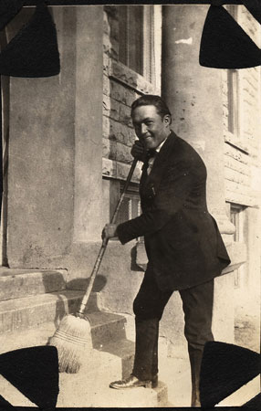 <man sweeping with a broom restored by terry>