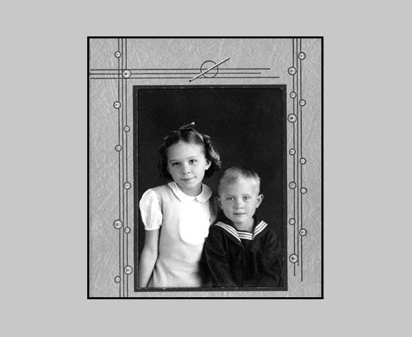 <adrienne and terry studio portrait. Terry wearing a sailor suit>